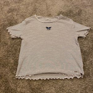 Hollister black and white striped top with a blue butterfly.